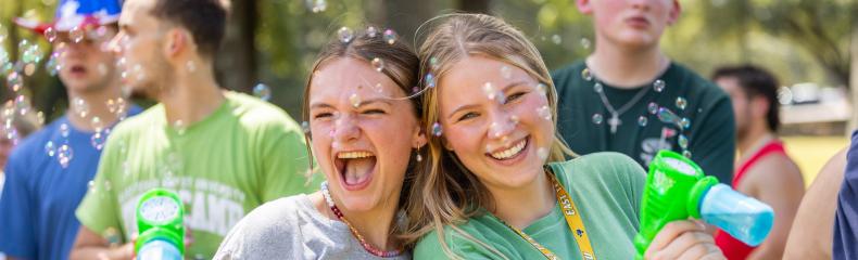 two girls with water guns