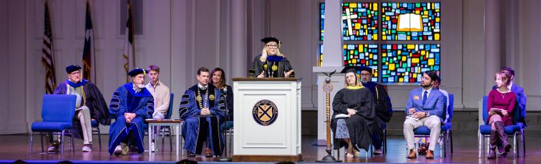 Dr. Hedgepath behind a podium